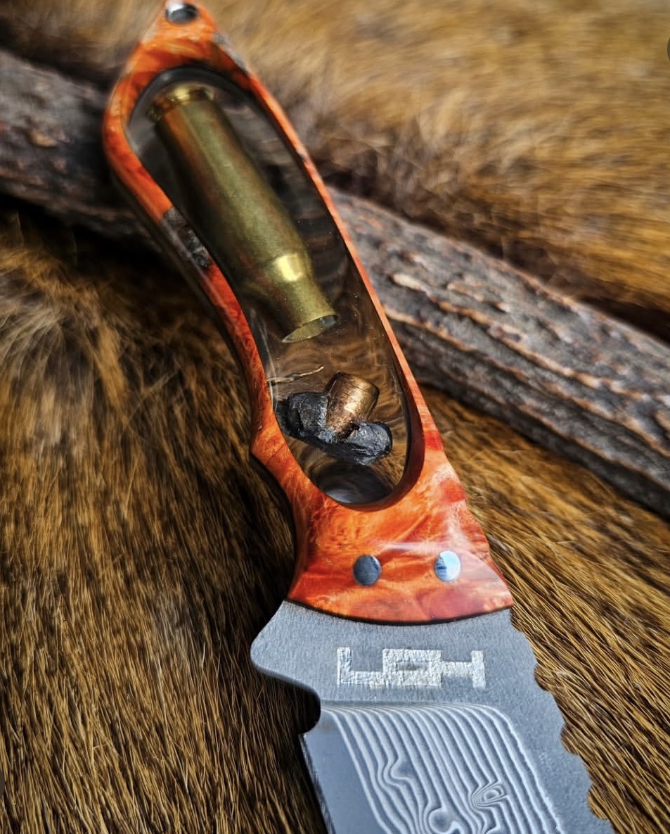 Knife handle detail with bullet casing